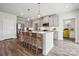 Bright kitchen featuring an island with bar seating, modern cabinets, and stainless steel appliances at 1229 Margo Mannor Dr, Fort Mill, SC 29708