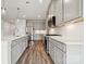 Bright kitchen boasts stainless appliances, a center island, and elegant gray cabinetry at 1229 Margo Mannor Dr, Fort Mill, SC 29708