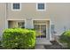 Backyard entrance with sliding glass door and trimmed bushes at 127 Walnut Cove Dr # D, Mooresville, NC 28117