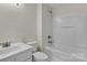 Cozy bathroom with white vanity and bathtub with white tile at 127 Walnut Cove Dr # D, Mooresville, NC 28117