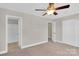 Inviting bedroom with ceiling fan, neutral carpet and ensuite bathroom and closet at 127 Walnut Cove Dr # D, Mooresville, NC 28117