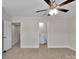 Bright bedroom featuring neutral walls, carpet floors and ceiling fan at 127 Walnut Cove Dr # D, Mooresville, NC 28117