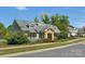 Community clubhouse with stone pillars and American flag at 127 Walnut Cove Dr # D, Mooresville, NC 28117