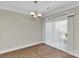Dining room featuring neutral walls, tile floor and a modern chandelier at 127 Walnut Cove Dr # D, Mooresville, NC 28117