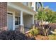 Spacious covered front porch with stylish stone accents on the support columns at 127 Walnut Cove Dr # D, Mooresville, NC 28117