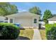 View of a detached garage with a small yard and landscaping at 127 Walnut Cove Dr # D, Mooresville, NC 28117