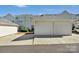View of the garage with two bays and a long driveway at 127 Walnut Cove Dr # D, Mooresville, NC 28117