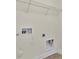Functional laundry area with hookups and storage rack at 127 Walnut Cove Dr # D, Mooresville, NC 28117