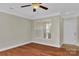 Living room featuring a large window, hardwood floors and neutral walls at 127 Walnut Cove Dr # D, Mooresville, NC 28117