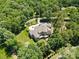 Stunning aerial view of a luxurious home nestled among verdant trees offering both privacy and grandeur at 1405 Saratoga Woods Dr, Waxhaw, NC 28173