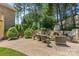 This stunning backyard features a stone fireplace and ample seating, perfect for outdoor gatherings at 1405 Saratoga Woods Dr, Waxhaw, NC 28173