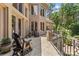 Elegant outdoor balcony with iron railings and comfortable seating, perfect for relaxation at 1405 Saratoga Woods Dr, Waxhaw, NC 28173