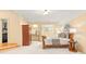 Bedroom with decorative lighting, built-in storage, and neutral colored carpet at 1405 Saratoga Woods Dr, Waxhaw, NC 28173