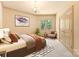 Bright bedroom with a chandelier, en-suite chair, carpet, and a framed print at 1405 Saratoga Woods Dr, Waxhaw, NC 28173