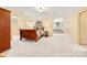 Spacious bedroom with a built-in window bench and neutral carpeting at 1405 Saratoga Woods Dr, Waxhaw, NC 28173