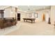 Large game room with a wet bar, pool table, and neutral carpet, great for entertainment at 1405 Saratoga Woods Dr, Waxhaw, NC 28173