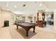 Spacious game room with a pool table, wet bar, and comfortable seating area perfect for entertaining at 1405 Saratoga Woods Dr, Waxhaw, NC 28173