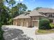 Large four car garage perfect for car collectors with manicured landscaping at 1405 Saratoga Woods Dr, Waxhaw, NC 28173