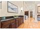 Hallway with dark wood built-ins and hardwood floors, leading to additional living spaces at 1405 Saratoga Woods Dr, Waxhaw, NC 28173