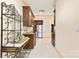 Kitchen area featuring stainless steel appliances, dark wood cabinetry, and a decorative iron shelf at 1405 Saratoga Woods Dr, Waxhaw, NC 28173