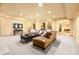 Finished basement area with a lounge area, bar area, and neutral carpet at 1405 Saratoga Woods Dr, Waxhaw, NC 28173