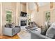 Spacious living room features a fireplace, neutral color palette, and vaulted ceilings with wood beam accents at 1405 Saratoga Woods Dr, Waxhaw, NC 28173