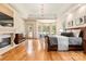 Spacious main bedroom with hardwood floors, trey ceilings, a fireplace, and sitting area near bay windows at 1405 Saratoga Woods Dr, Waxhaw, NC 28173
