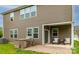 Backyard features a covered patio with furniture, a built-in grill, and exterior access at 150 W Morehouse Ave, Mooresville, NC 28117