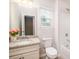 Bathroom featuring a single sink with floral adornments beside a tub and toilet combination at 150 W Morehouse Ave, Mooresville, NC 28117