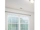 Bedroom featuring a window that brings in natural light, complementing the neutral wall color at 150 W Morehouse Ave, Mooresville, NC 28117