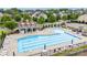 An aerial view of the community pool with lounge chairs and tables at 150 W Morehouse Ave, Mooresville, NC 28117