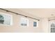 Bright living area featuring large windows, recessed lighting, and stylish curtain rods at 150 W Morehouse Ave, Mooresville, NC 28117