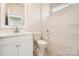 Bathroom with a single sink vanity, tub, and tile flooring at 1540 Croydon St, Indian Land, SC 29707