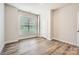 Well-lit bedroom with neutral walls, hardwood floors, and a window at 1540 Croydon St, Indian Land, SC 29707