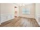 Dining room featuring wainscoting, hardwood floors, and a modern chandelier at 1540 Croydon St, Indian Land, SC 29707