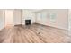 Bright living room with a fireplace, hardwood floors, and large windows at 1540 Croydon St, Indian Land, SC 29707