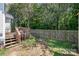 Fenced backyard with wood deck offering plenty of space for outdoor activities at 159 Pitts School Nw Rd, Concord, NC 28027