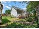 Backyard features a wooden deck, shed and is surrounded by a privacy fence at 159 Pitts School Nw Rd, Concord, NC 28027