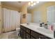 Bathroom with double sinks, a large mirror, ample counter space, and a shower/tub combo at 159 Pitts School Nw Rd, Concord, NC 28027