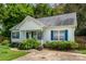 Charming single-story home with white siding, blue shutters, and inviting landscaping at 159 Pitts School Nw Rd, Concord, NC 28027