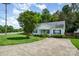 Well-maintained home with mature landscaping and spacious driveway at 159 Pitts School Nw Rd, Concord, NC 28027