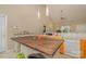 Bright and open kitchen with modern appliances, wooden cabinets, and an island with a dark wood countertop at 159 Pitts School Nw Rd, Concord, NC 28027
