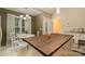 Bright kitchen and dining area with a dark wood island, built in cabinets, and a door leading outside at 159 Pitts School Nw Rd, Concord, NC 28027