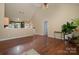 Living room with hardwood floors, high ceilings, a view to the kitchen, and a bright, open feel at 159 Pitts School Nw Rd, Concord, NC 28027