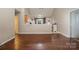 This open concept living room features hardwood floors and is adjacent to the kitchen and dining room at 159 Pitts School Nw Rd, Concord, NC 28027