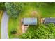 An aerial shot shows the home and surrounding green, lush neighborhood at 1606 Northwoods Dr, Kings Mountain, NC 28086