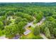 An aerial view shows the neighborhood's canopy of mature trees and lush green lawns at 1606 Northwoods Dr, Kings Mountain, NC 28086
