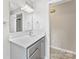 Bright bathroom featuring vanity with ample storage space and updated fixtures at 1606 Northwoods Dr, Kings Mountain, NC 28086