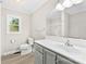 Bright bathroom features new vanity, updated fixtures, and a window for natural light at 1606 Northwoods Dr, Kings Mountain, NC 28086