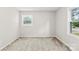 Neutral bedroom features a carpeted floor and two windows for ample natural light at 1606 Northwoods Dr, Kings Mountain, NC 28086